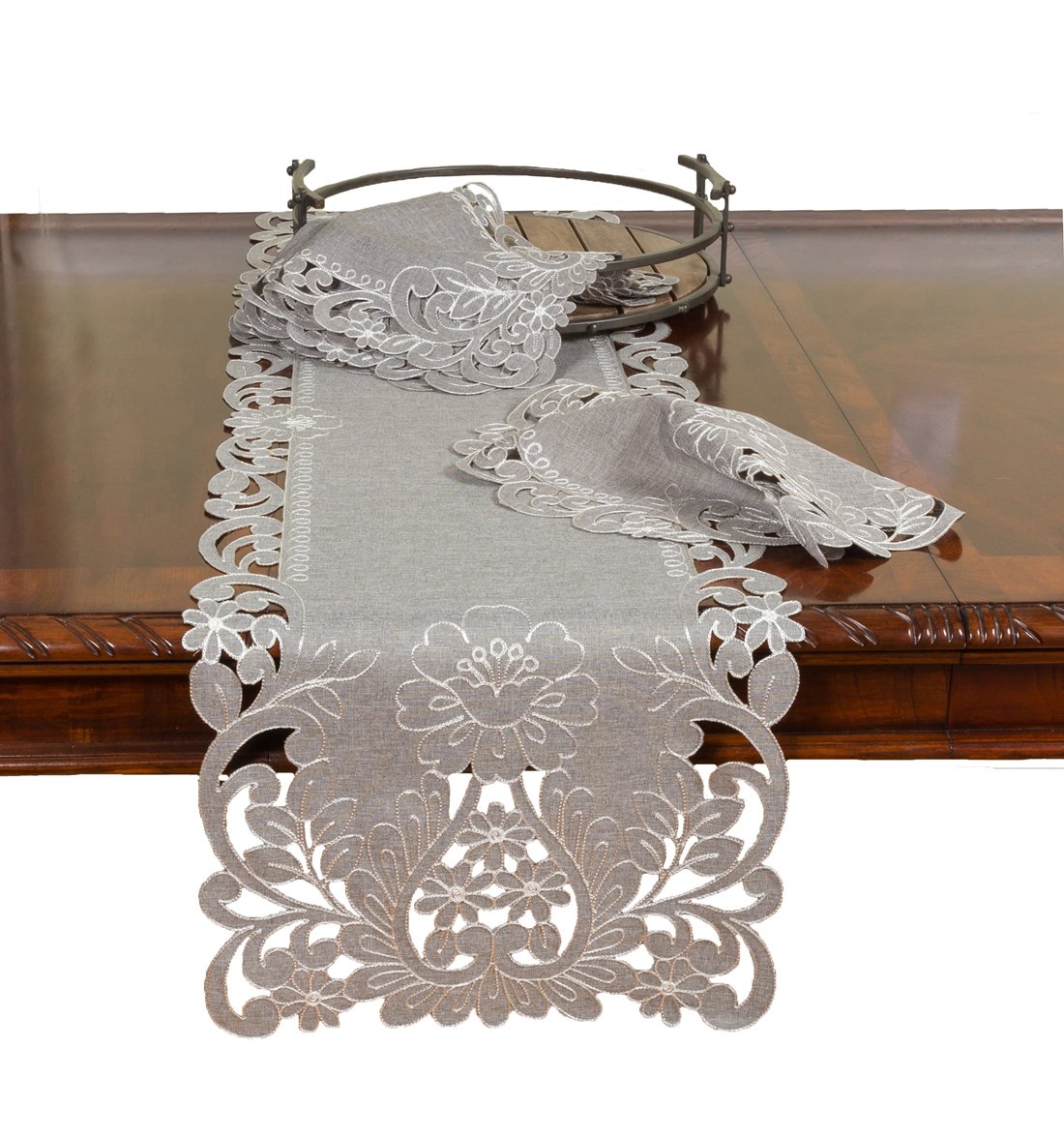 XD18349 Claire Floral Table Runner featuring floral cutwork edges on a textured grey background with exotic embroidery designs.