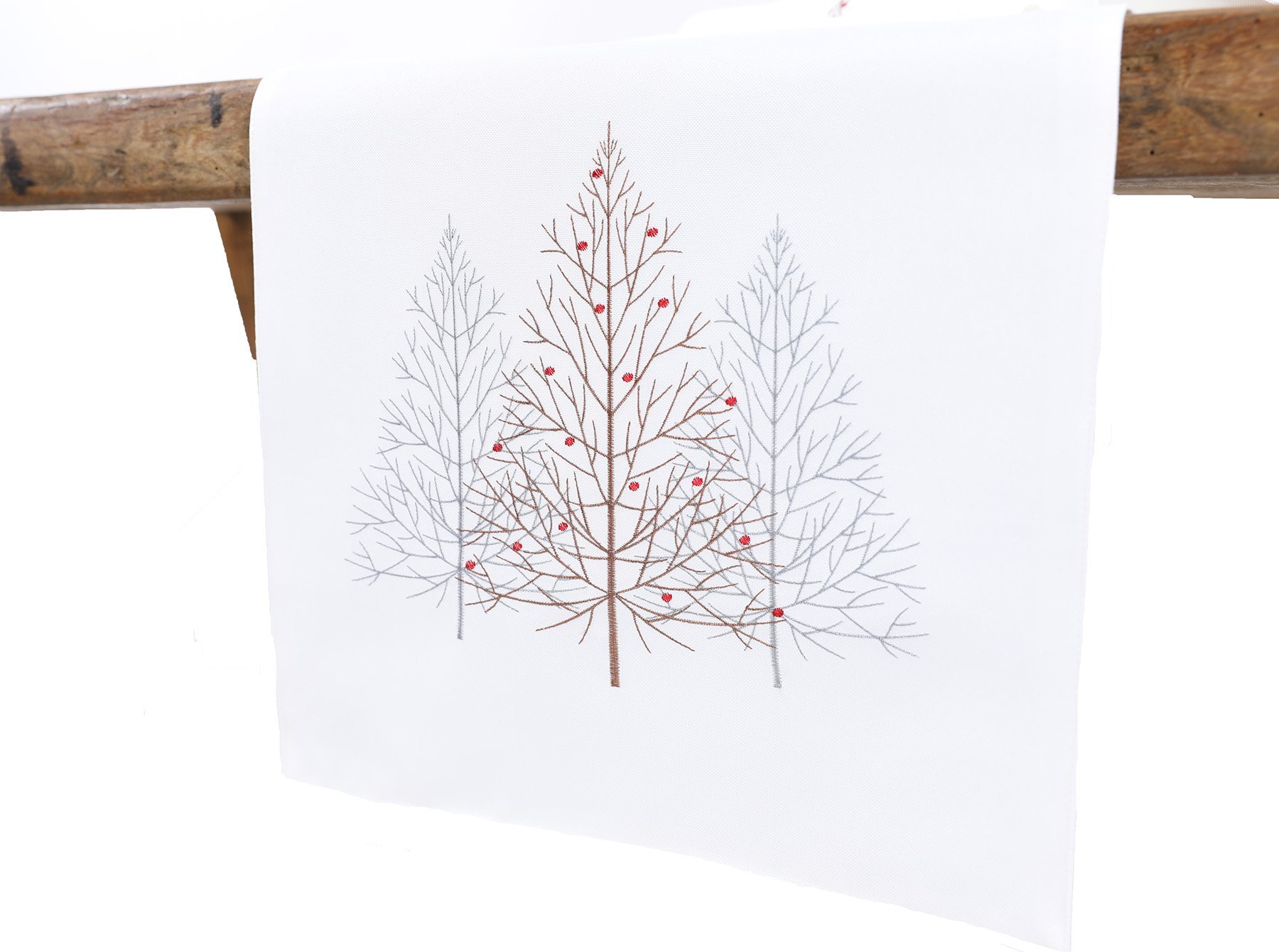 XD19803 Festive Trees Embroidered Christmas Table Runner featuring white Christmas trees and winter berries on a white background.