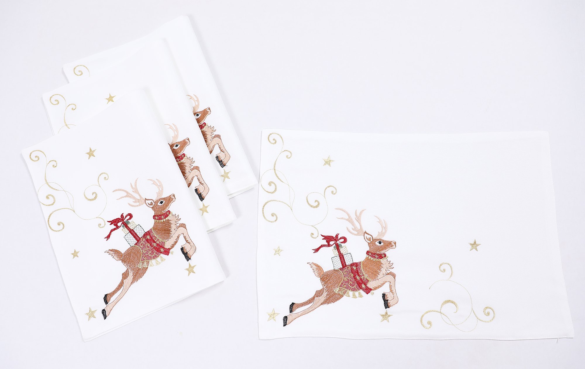 Embroidered Christmas placemats featuring lively reindeer with gifts, adorned with golden ribbons and stars, perfect for holiday dining.