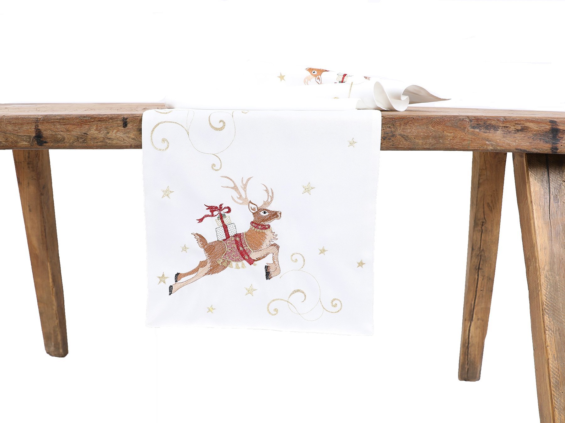 Embroidered Christmas table runner featuring lively reindeer with gifts, adorned with golden ribbons and stars, perfect for festive dining.