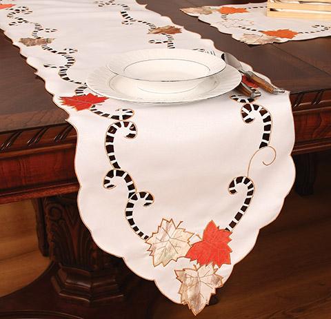 XD46211 Scrolling Leaf Table Runner featuring intricate autumn leaf embroidery on a poliviscose background, perfect for holiday dining.