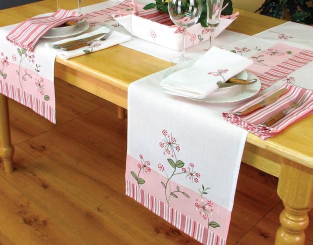 XD755002 Whimsy Collection table linens featuring cheerful floral embroidery and colorful stripes, perfect for spring and summer settings.