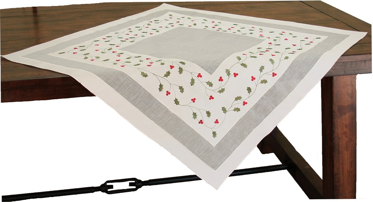 XD93253 Classic Holly Table Topper featuring embroidered holly leaves and berries, perfect for Christmas dining decor.