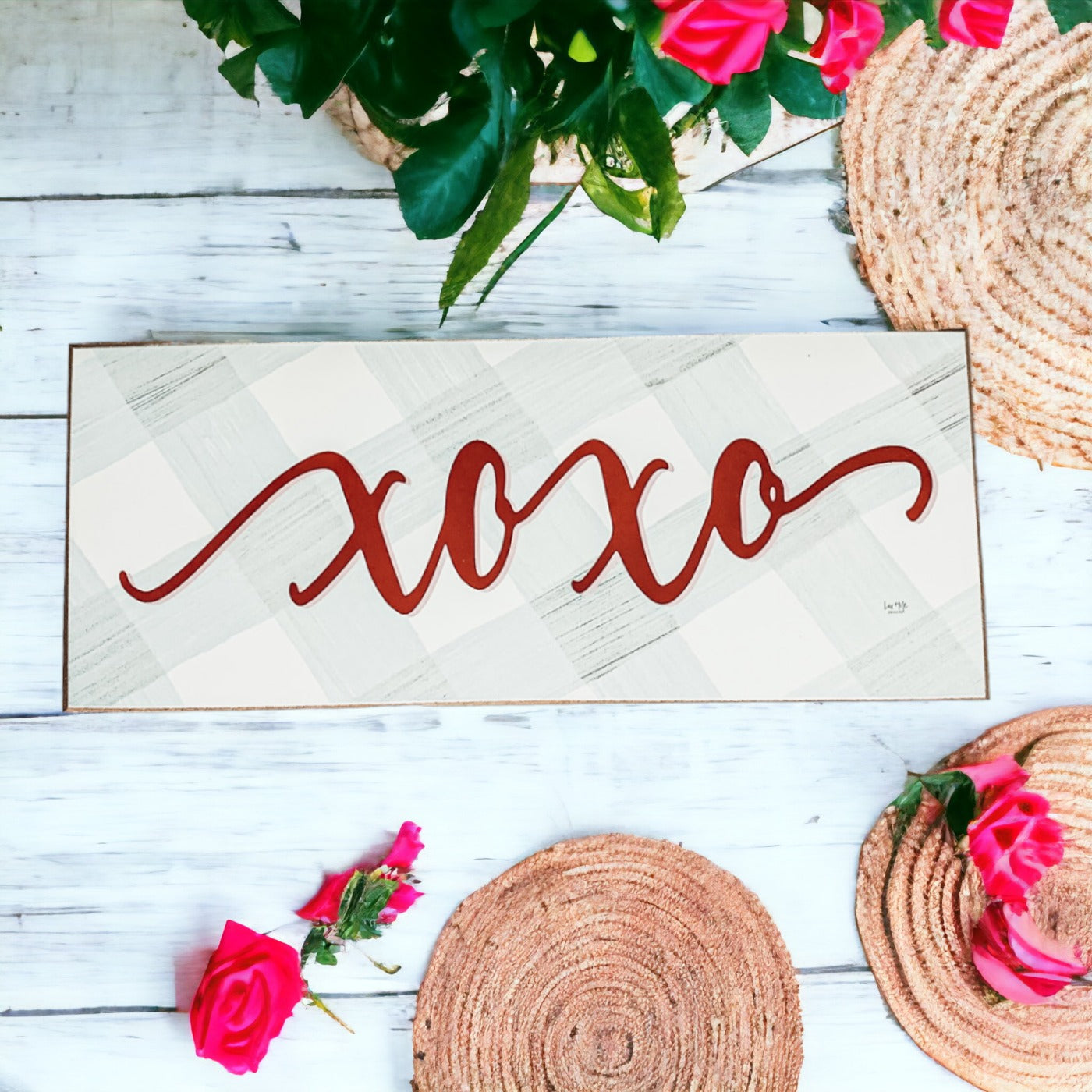 Handmade XOXO Sign made of thick wood with a light gray and white checkered background and darker red script, perfect for Valentine's Day decor.