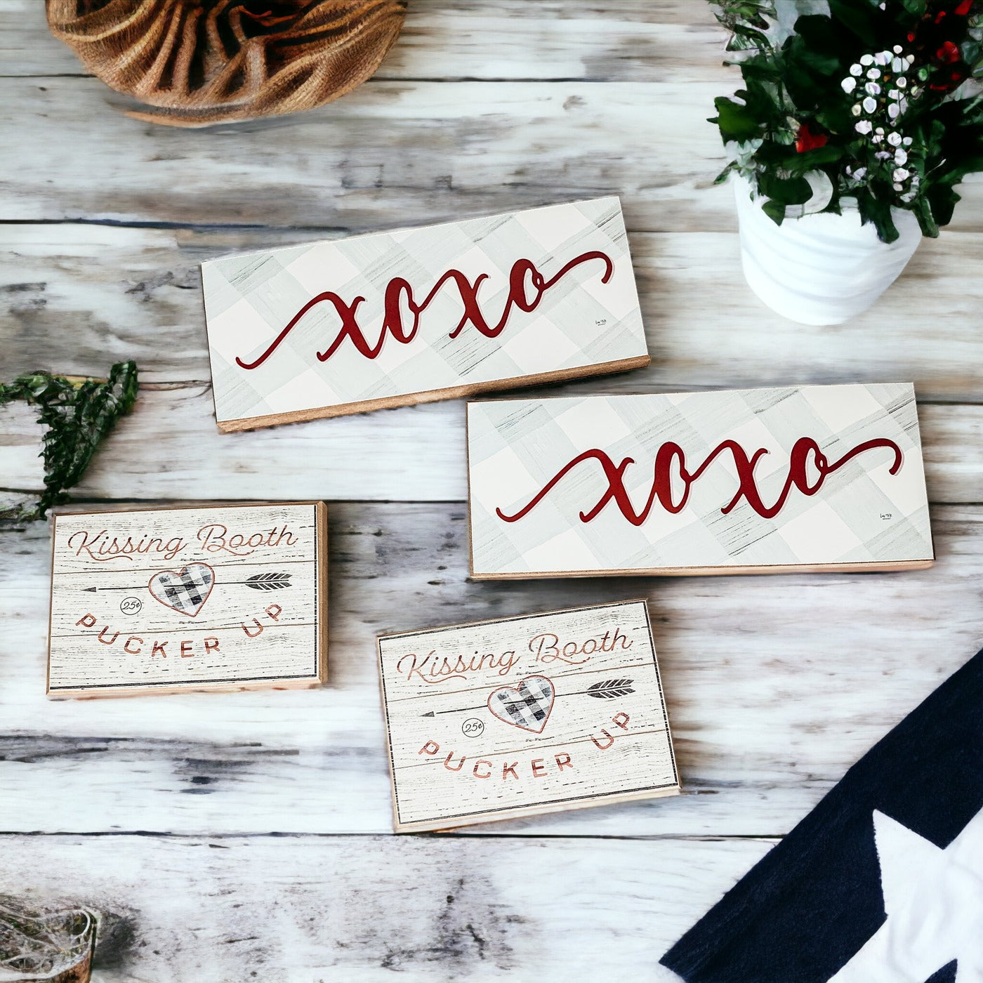 Handmade XOXO Sign made of thick wood with a light gray and white checkered background and darker red script, perfect for Valentine's Day decor.