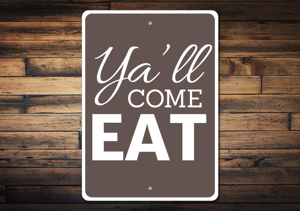 A decorative Ya'll Come Eat sign made of high-quality aluminum, featuring customizable text, perfect for home decor.