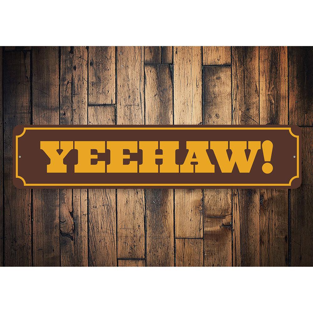 A decorative Yeehaw sign made of high-quality aluminum, featuring a rustic design perfect for barns and kitchens.