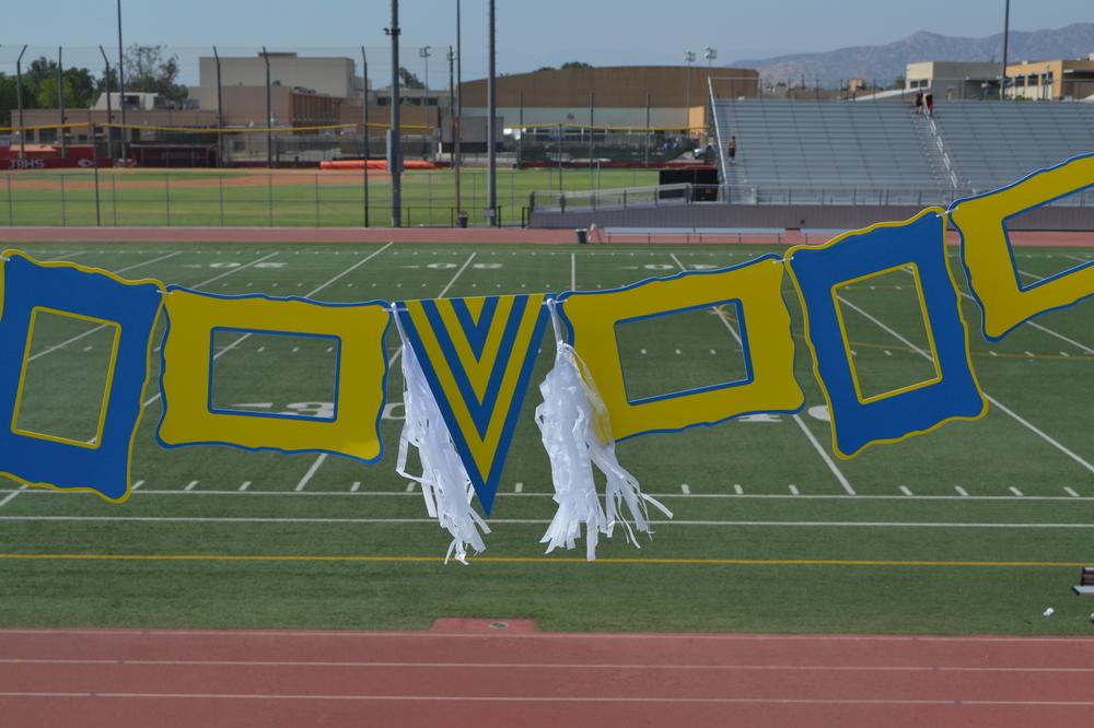 A vibrant Yellow & Blue decor set featuring 6 paper frames, a pennant, hanging ribbon, and paper tassels, perfect for festive occasions.