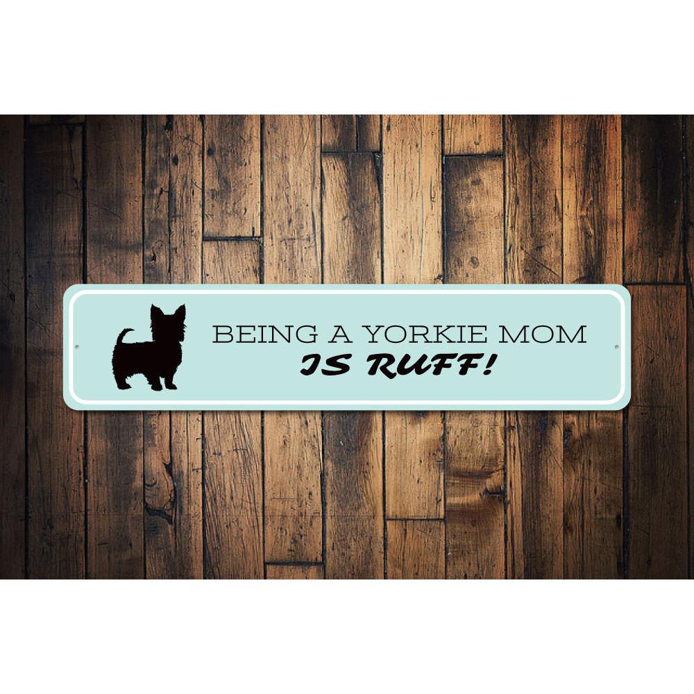 A decorative Yorkie Mom Sign made of high-quality aluminum, featuring a charming design perfect for dog lovers.