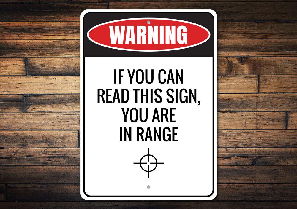 You Are in Range Sign made of high-quality aluminum, featuring customizable text and pre-drilled holes for easy mounting.