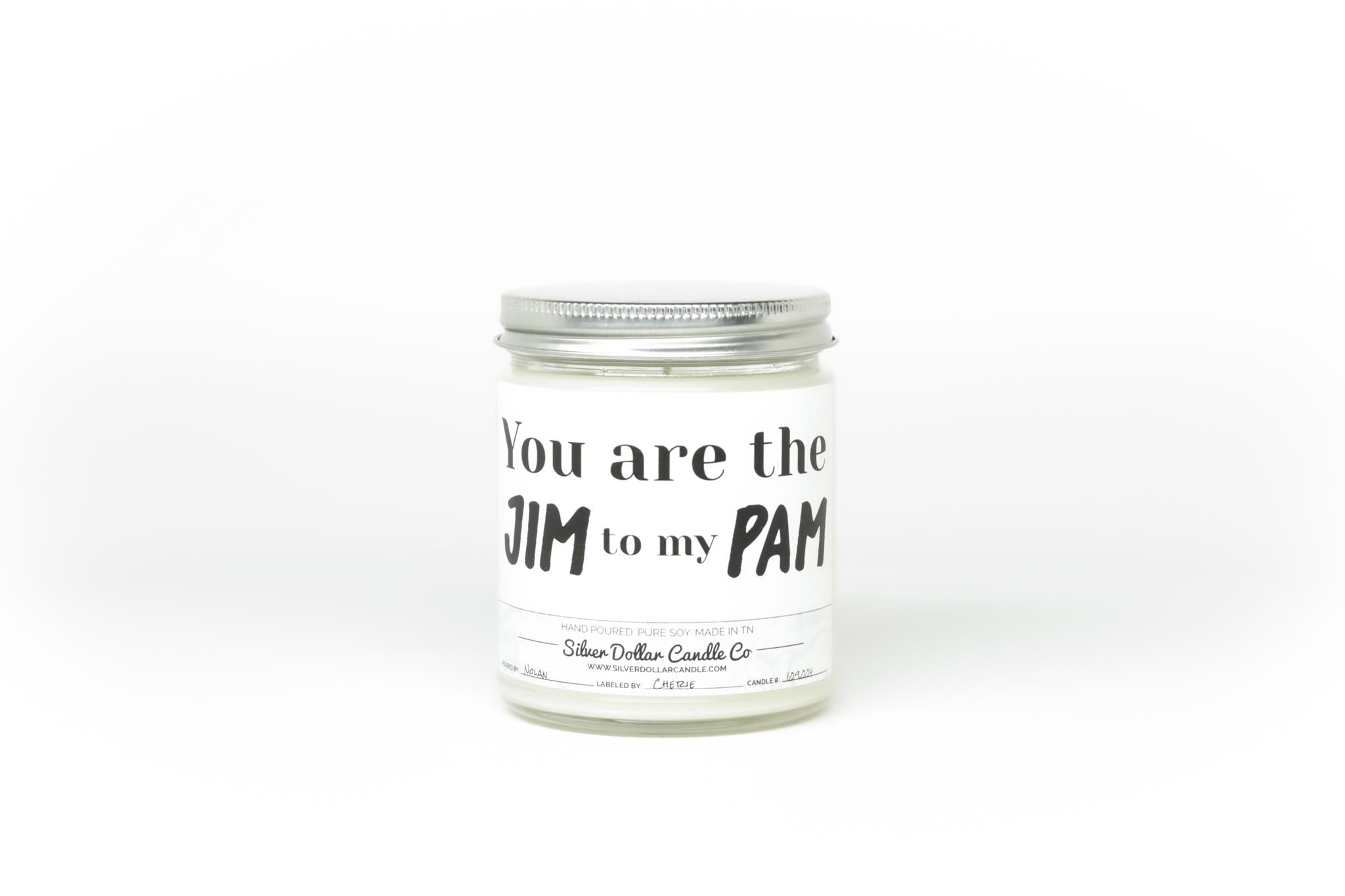 A beautifully designed candle labeled 'You Are The Jim to my Pam', showcasing its romantic theme and available scents.