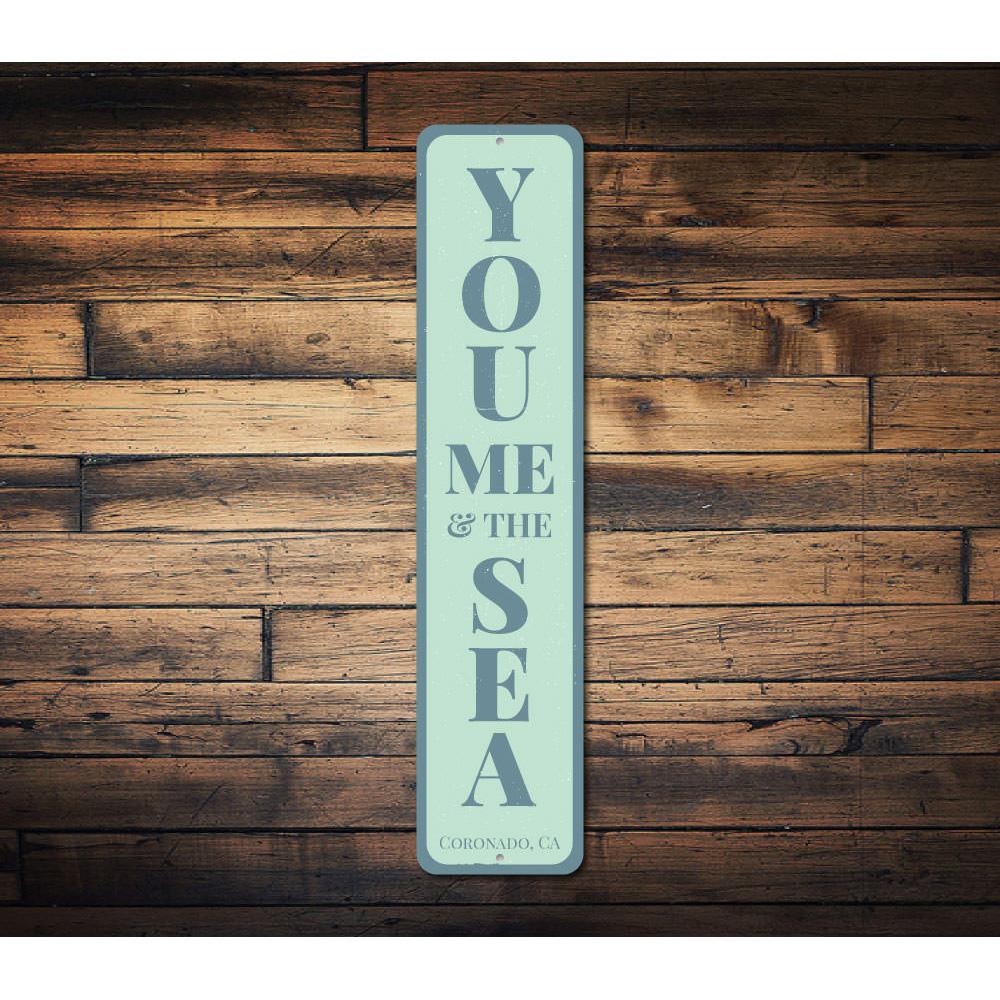 You Me & The Sea Vertical Sign made of durable aluminum, featuring a coastal design perfect for home decor.