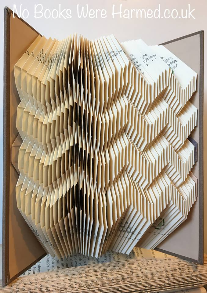 Zig Zag art piece handcrafted from vintage books, showcasing intricate folds and unique design.