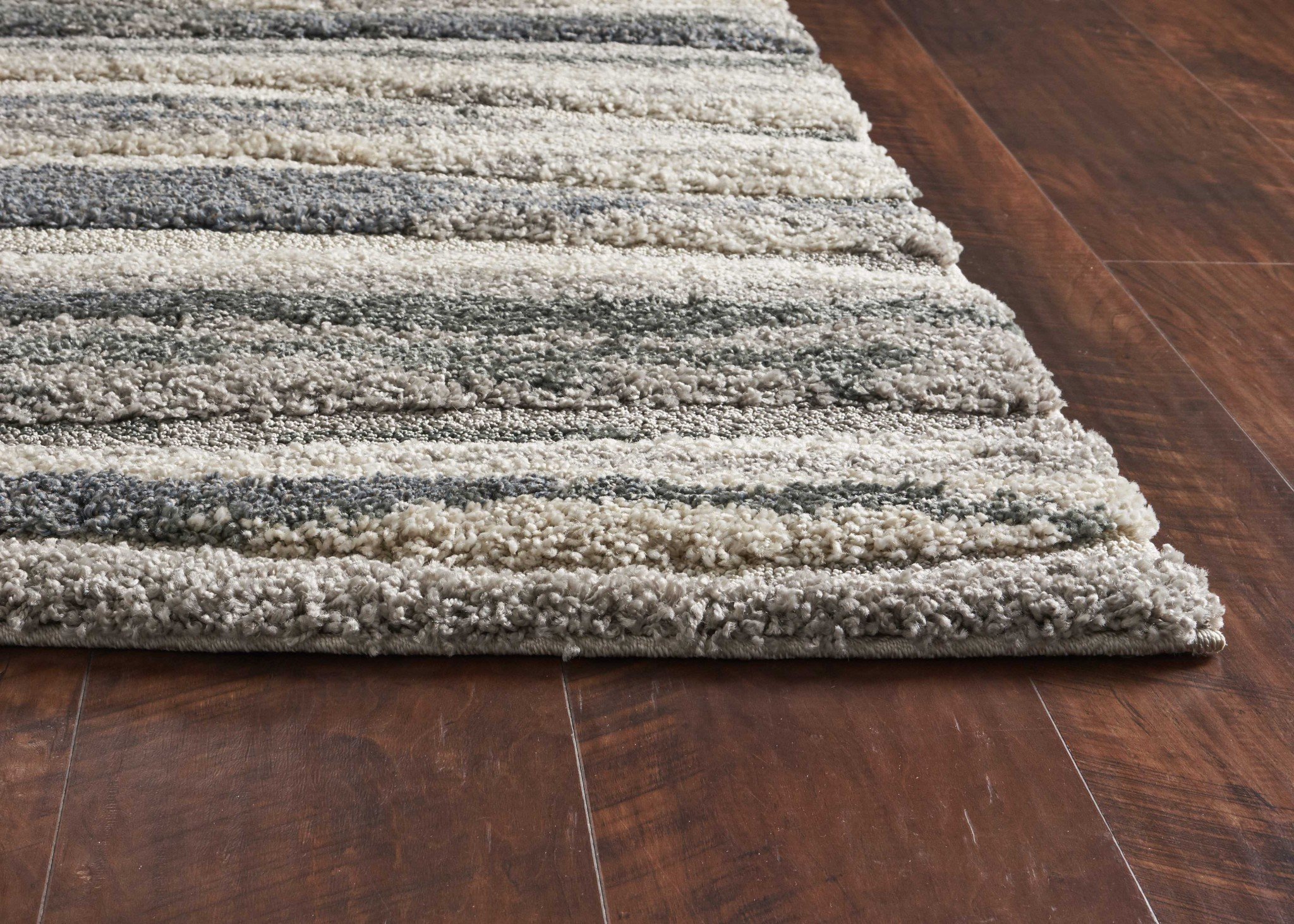 39" x 63" Grey Polypropylene Rug with plush hi-lo pile and stylish landscape design, perfect for enhancing home decor.