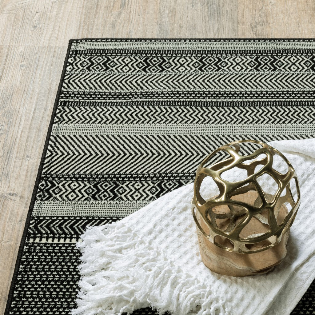 8-inch Black Ivory Machine Woven Geometric Indoor Runner Rug featuring intricate ivory stripes on a black background, perfect for high traffic areas.