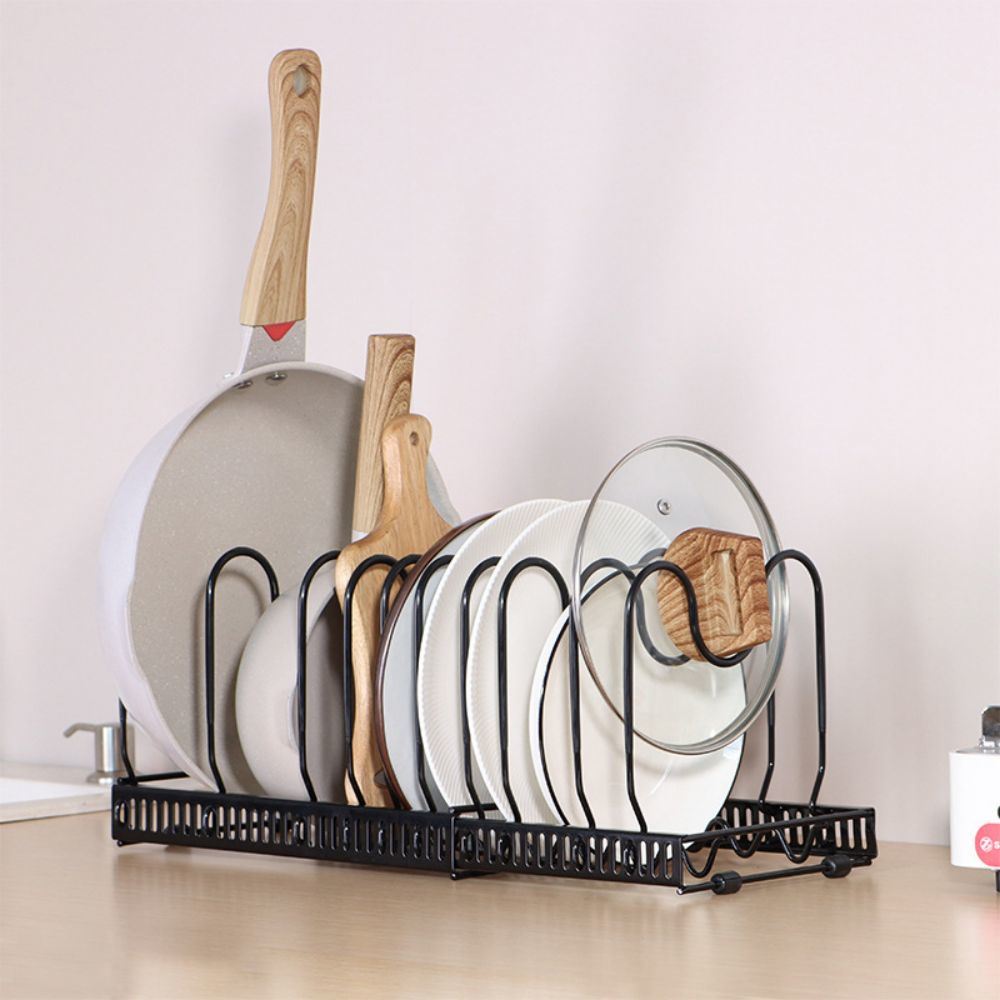 Adjustable kitchen pot rack with pots, lids, and cutting boards organized neatly.