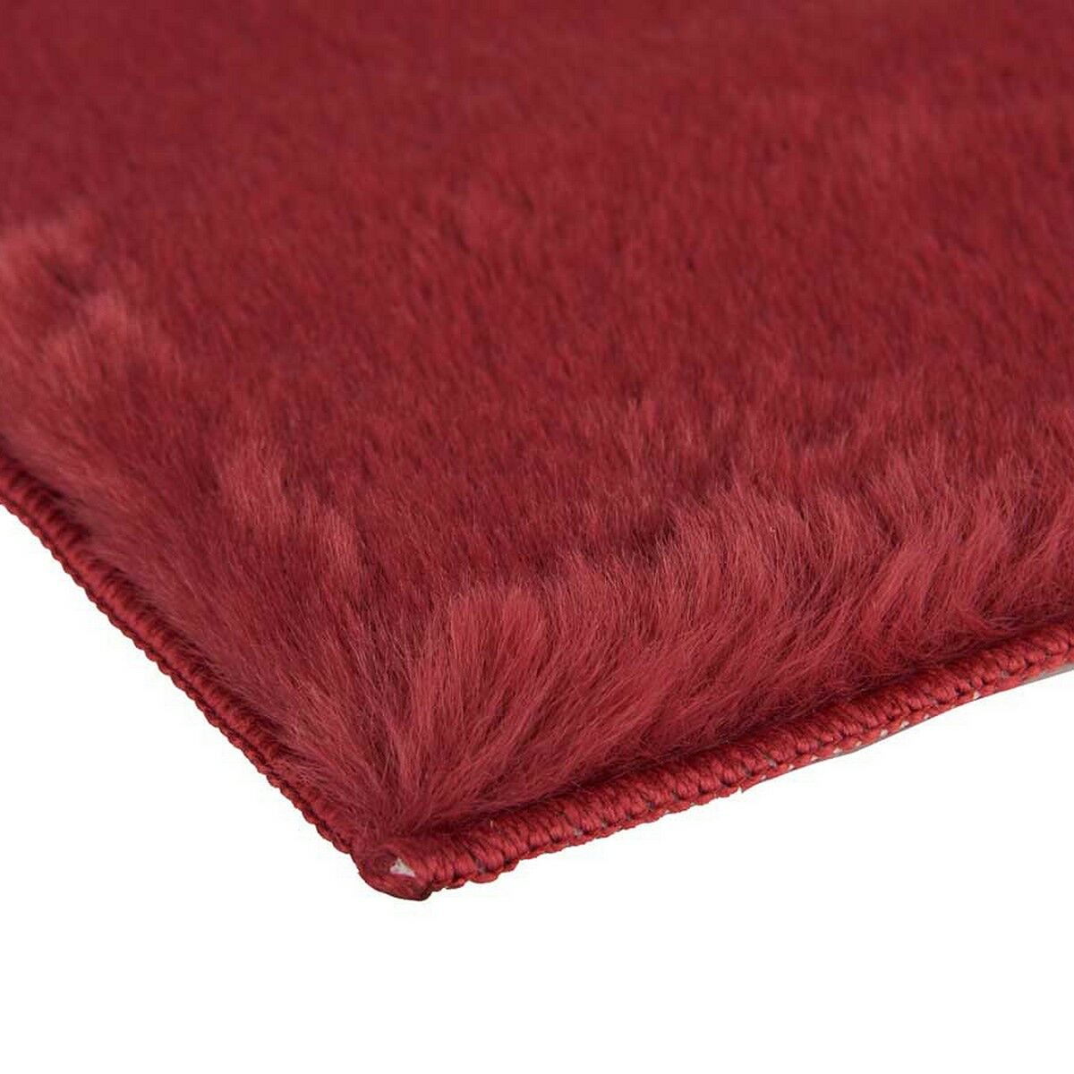 Close-up of red fluffy rug.