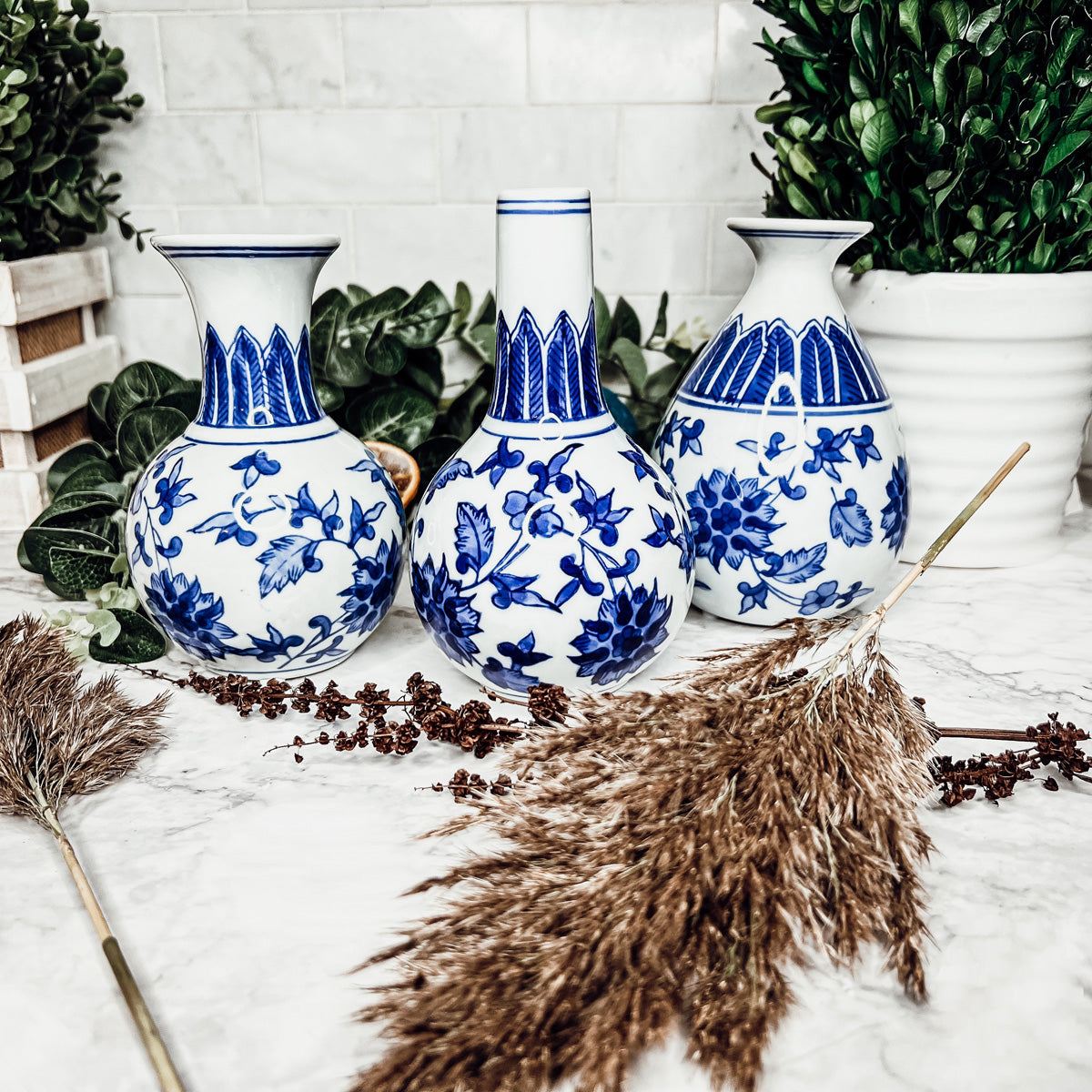 Elegant Chinoiserie Mediterranean Canton Vases in blue and white, showcasing intricate hand-painted designs, perfect for home decor.