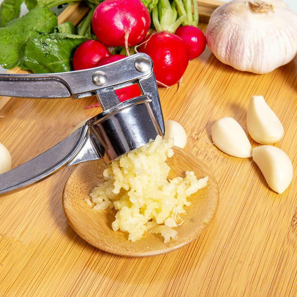 Heavy-duty stainless steel garlic press with ergonomic design, showcasing its durable zinc alloy construction and large cabin for multiple cloves.