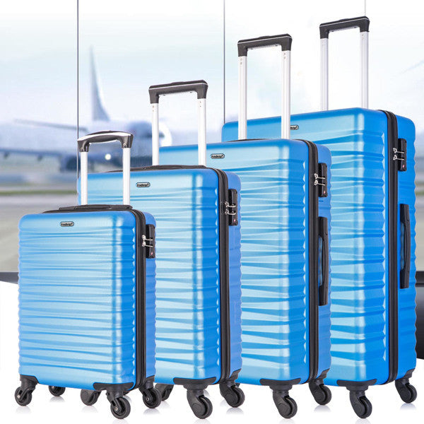 Four-piece hardshell luggage set in blue, made of lightweight ABS material with spinner wheels and TSA-approved locks.