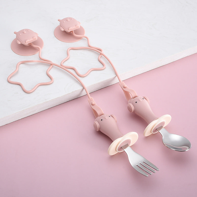 Infant Stainless Steel Training Spoon Fork with anti-drop chain and suction cup, designed for easy grip and self-feeding.