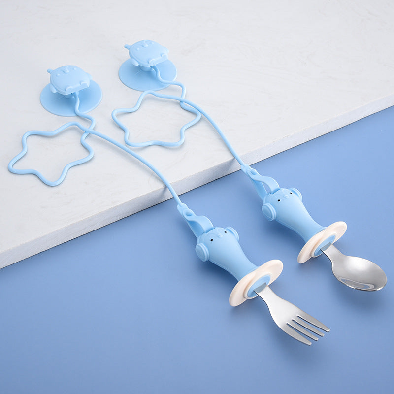 Infant Stainless Steel Training Spoon Fork with anti-drop chain and suction cup, designed for easy grip and self-feeding.