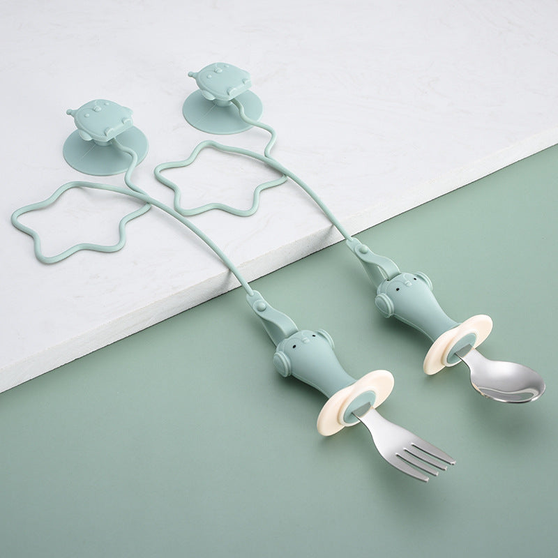 Infant Stainless Steel Training Spoon Fork with anti-drop chain and suction cup, designed for easy grip and self-feeding.