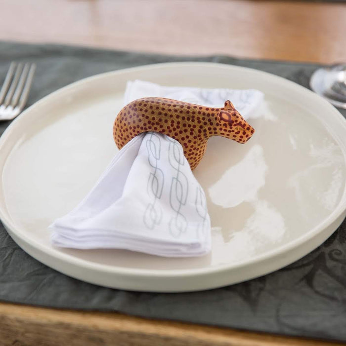 Set of six hand-carved African wooden napkin rings featuring giraffe, elephant, cheetah, zebra, rhino, and lion designs.