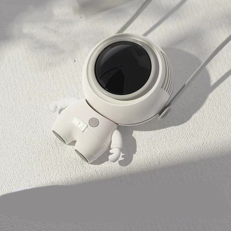 A small handheld personal neck fan designed like an astronaut, featuring a USB charging port and a sleek, portable design.