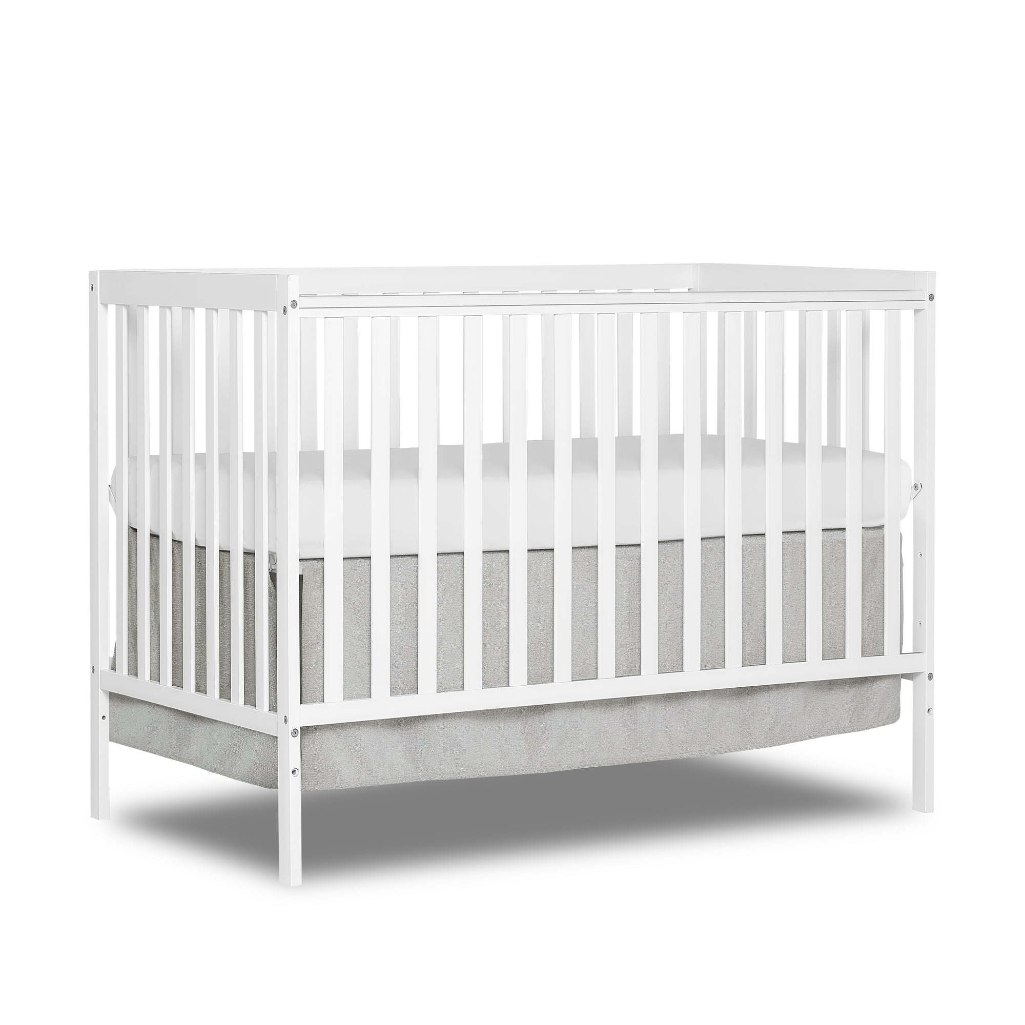 Synergy 5-in-1 Convertible Crib in white, showcasing its classic design and solid pine wood construction.