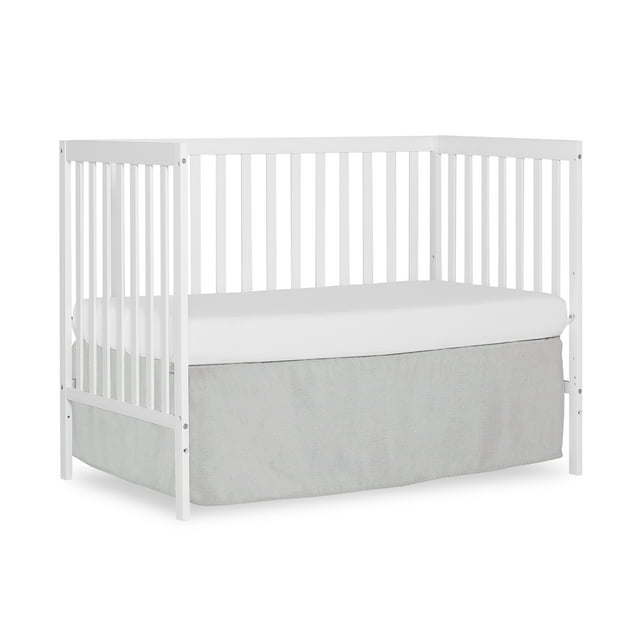 Synergy 5-in-1 Convertible Crib in white, showcasing its classic design and solid pine wood construction.