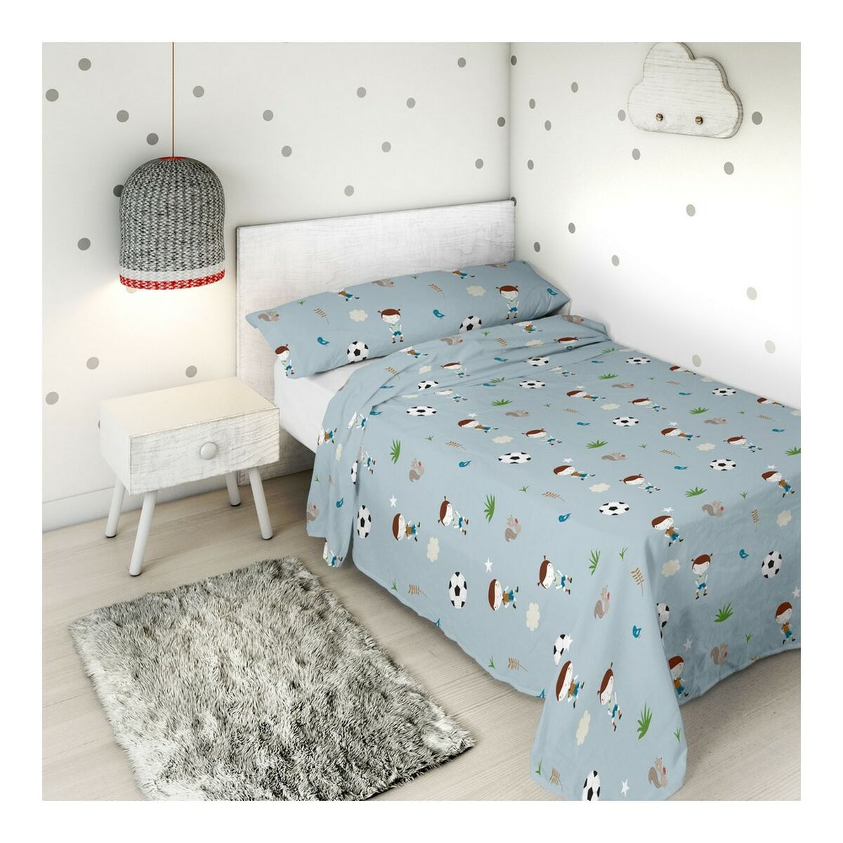 Children's bedroom with soccer-themed bedding.