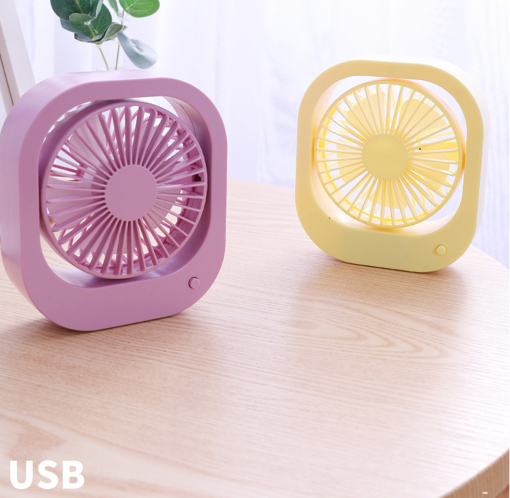 A compact USB desk fan with two speed settings, designed for portable use on a desktop or table.