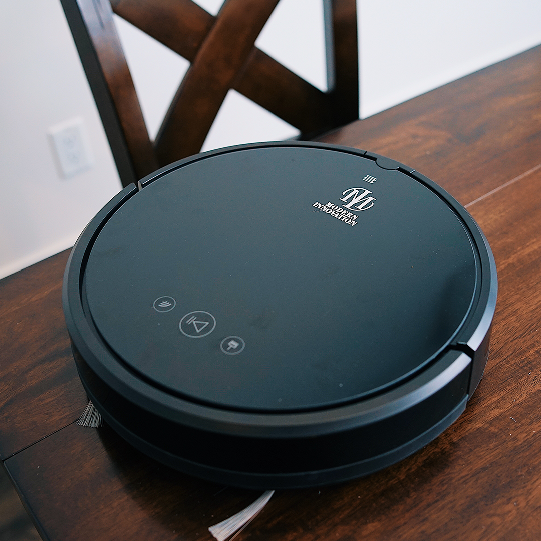 WiFi Robot Vacuum cleaning a hardwood floor, showcasing its sleek design and smart navigation features.