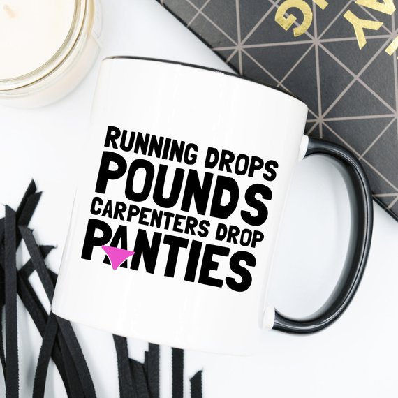 A humorous 11oz coffee mug featuring the phrase 'Running Drops Pounds, Carpenters Drop Panties' in a vibrant design.