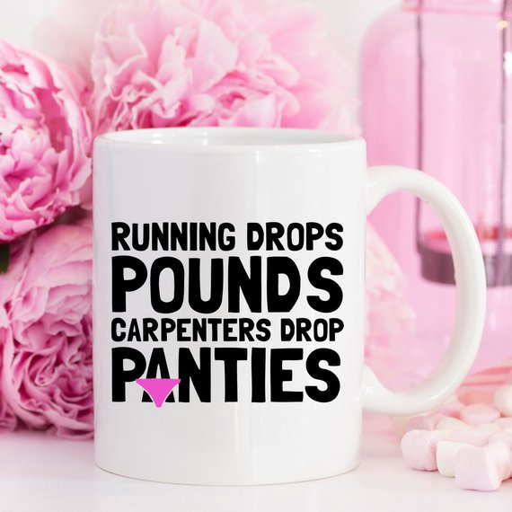 A humorous 11oz coffee mug featuring the phrase 'Running Drops Pounds, Carpenters Drop Panties' in a vibrant design.