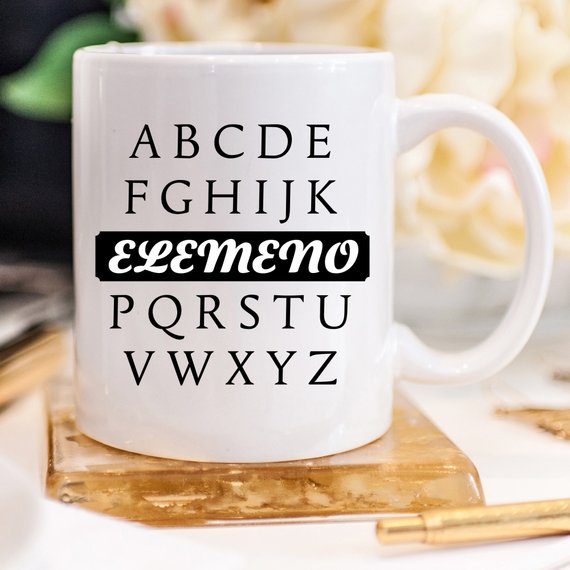 A humorous coffee mug featuring the phrase A, B, C, D, E, F, G, H, I, J, K, ELEMENO, P, Q, R, S, T, U, V, W, X, Y, Z, crafted from high-quality ceramic.