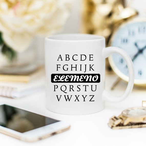 A humorous coffee mug featuring the phrase A, B, C, D, E, F, G, H, I, J, K, ELEMENO, P, Q, R, S, T, U, V, W, X, Y, Z, crafted from high-quality ceramic.