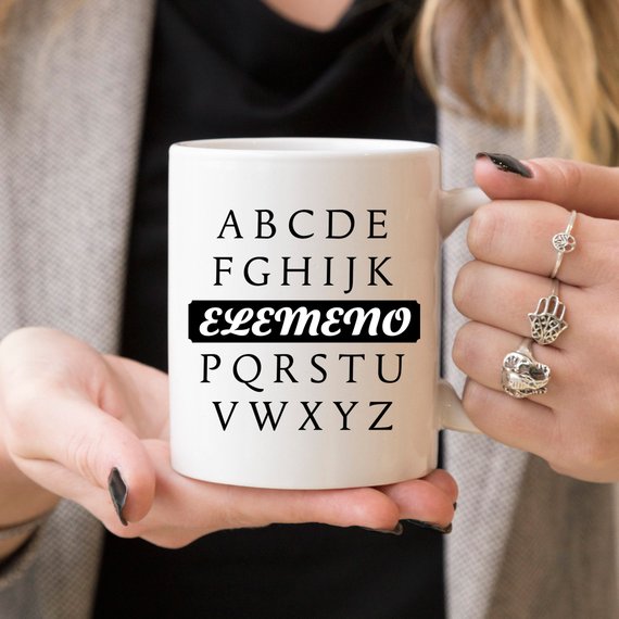 A humorous coffee mug featuring the phrase A, B, C, D, E, F, G, H, I, J, K, ELEMENO, P, Q, R, S, T, U, V, W, X, Y, Z, crafted from high-quality ceramic.