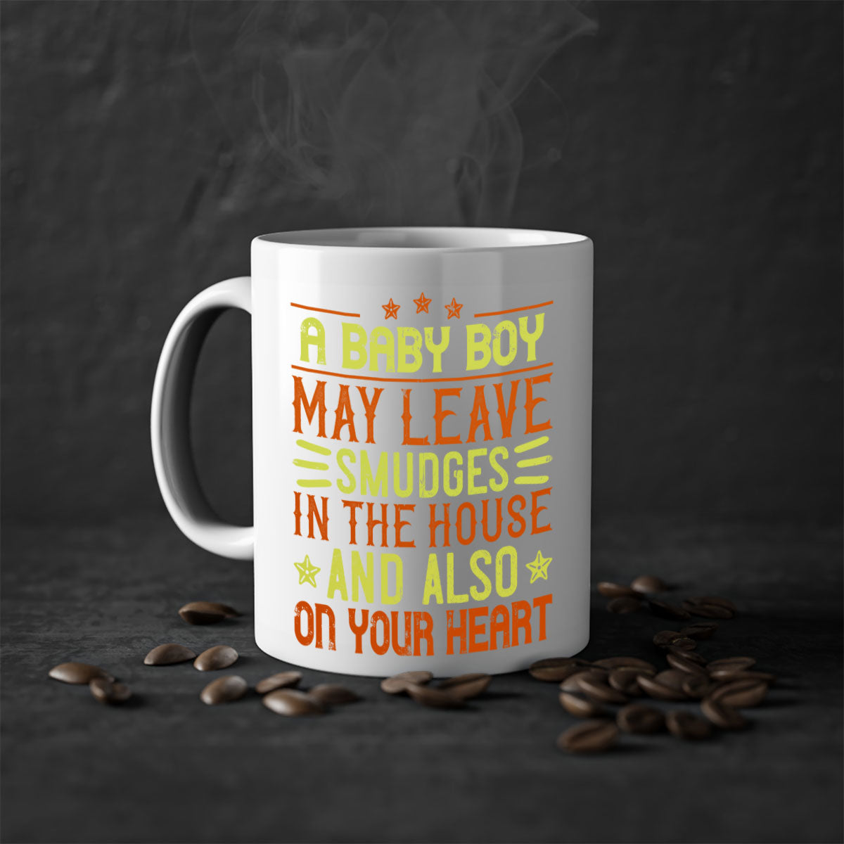 A stylish two-tone ceramic mug with a colored handle and glossy finish, perfect for coffee or tea, featuring the phrase 'A baby boy may leave smudges in the house and also on your heart.'