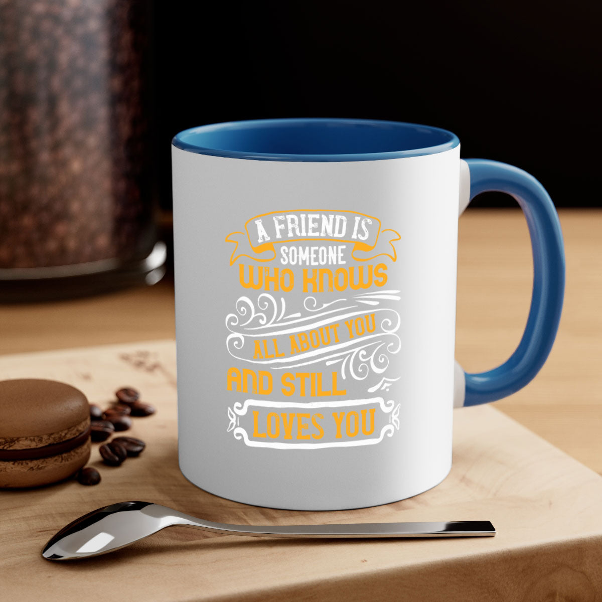 A stylish two-tone ceramic mug with a colored handle and glossy finish, featuring the phrase 'A friend is someone who knows all about you and still loves you'.