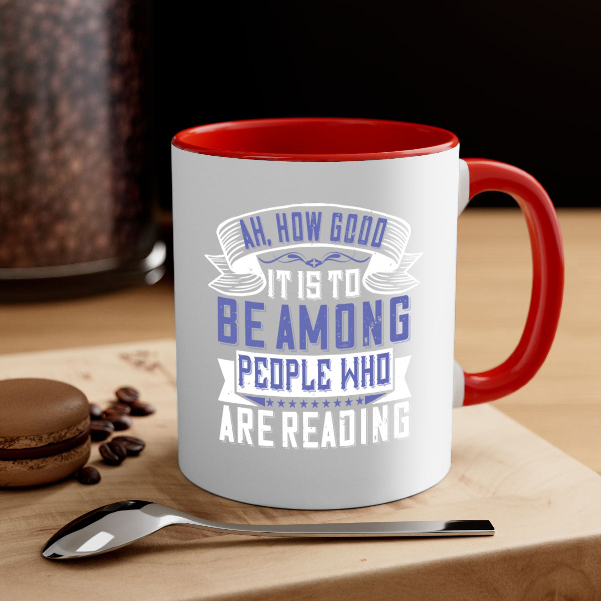 A stylish two-tone ceramic mug with a colored handle and interior, featuring the phrase 'ah how good it is to be among people who are reading 77#'.