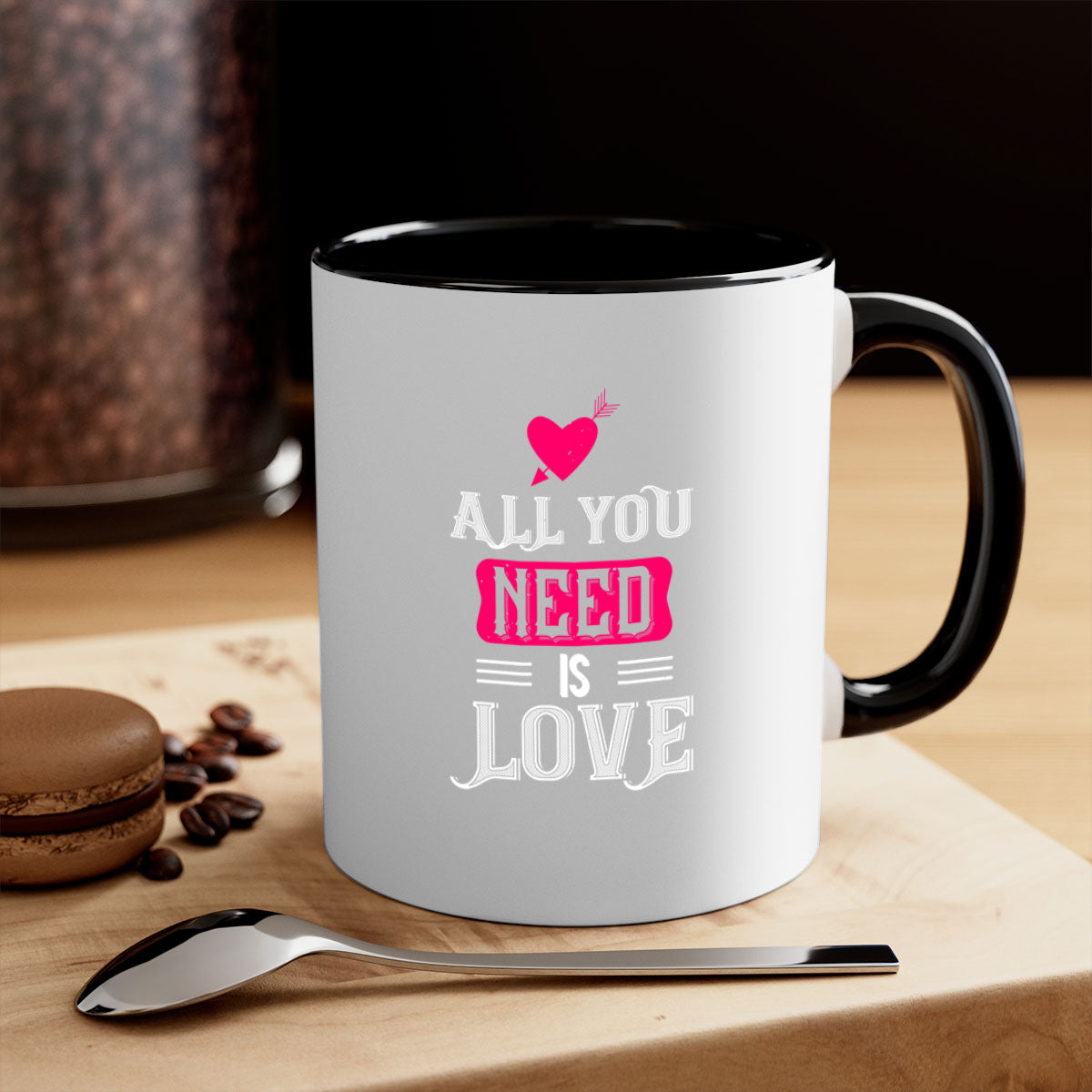 A stylish two-tone 'All You Need Is Love' mug with a glossy finish, featuring a colored handle and interior, perfect for coffee or tea.