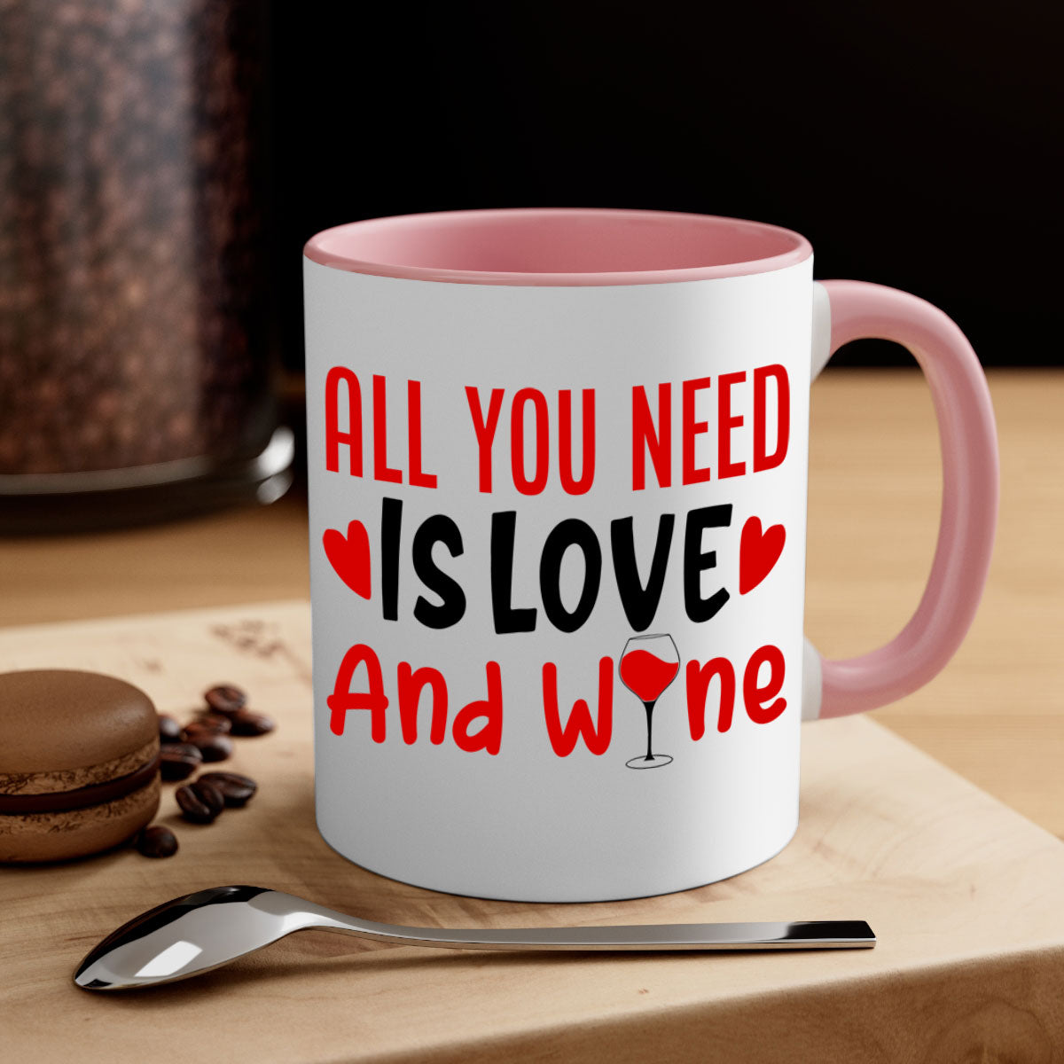 A stylish two-tone ceramic mug with the phrase 'All You Need Is Love and Wine', featuring a colored handle and glossy finish.