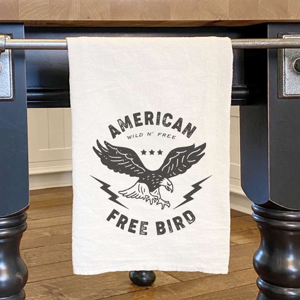 American Free Bird Cotton Tea Towel featuring vibrant design and hemmed edges, measuring 27 inches square.