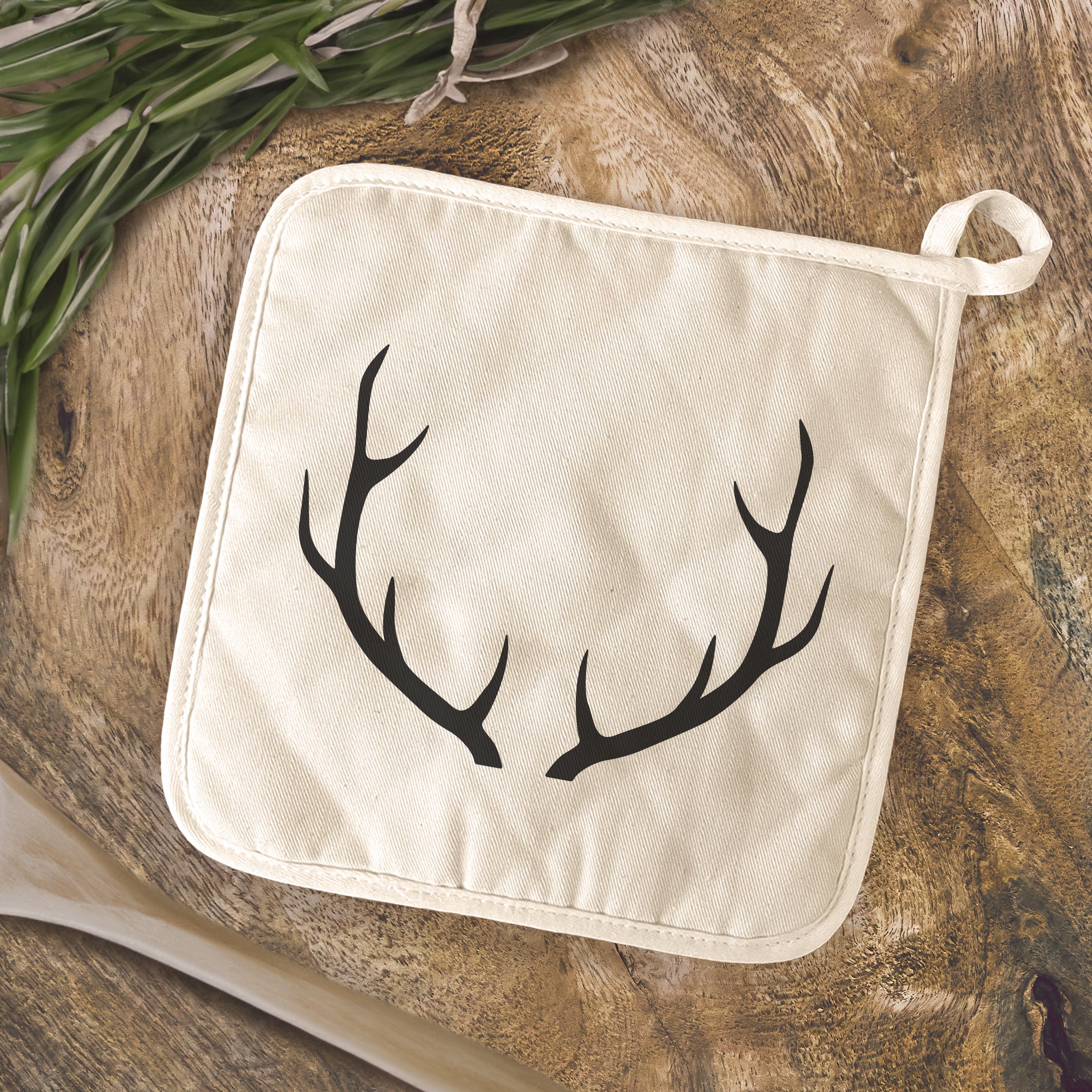 Antlers Cotton Pot Holder featuring a vibrant design, made from natural-color cotton and quilted terry cloth, perfect for protecting surfaces from hot cookware.