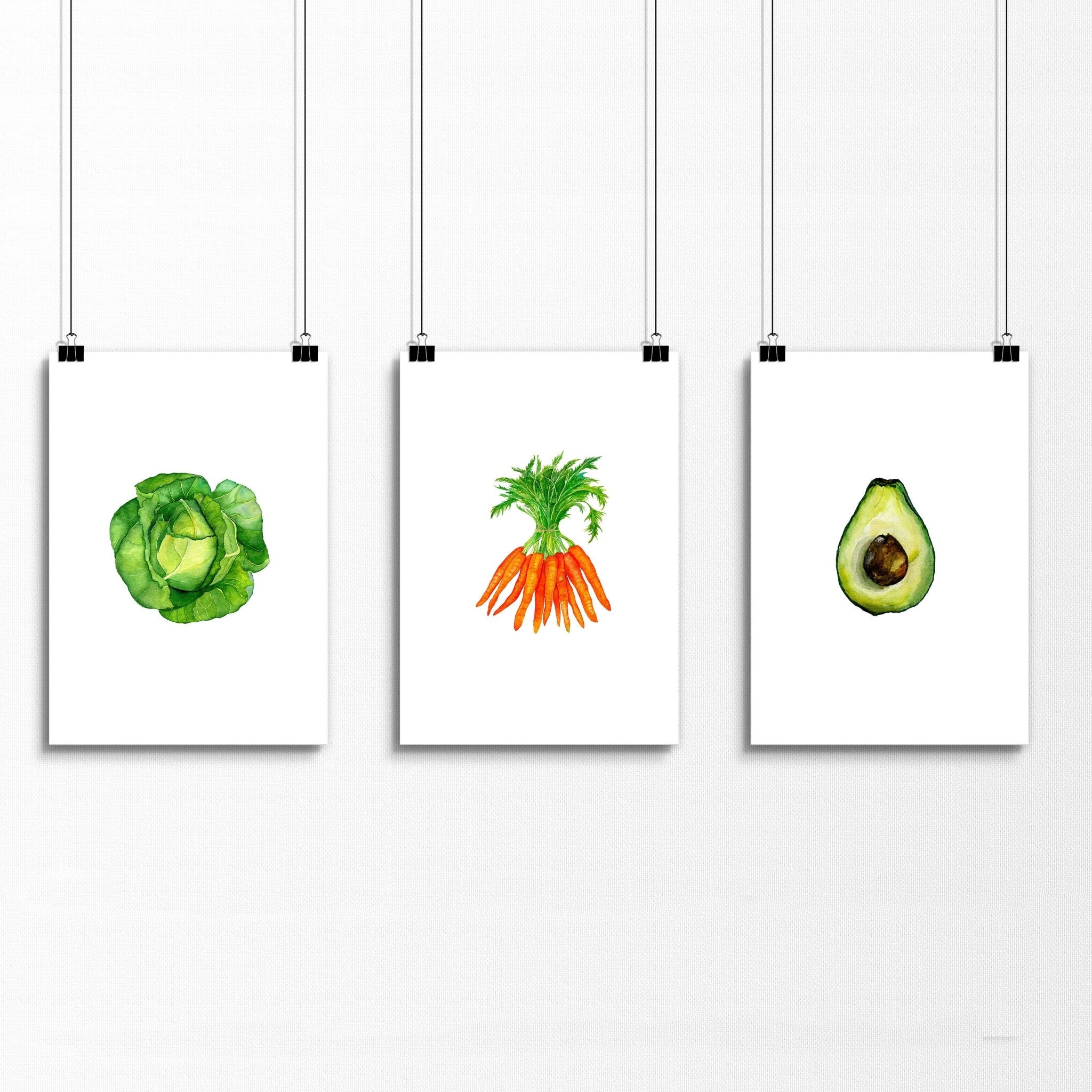 Set of 3 framed vegetable prints showcasing vibrant illustrations of vegetables, perfect for kitchen decor.