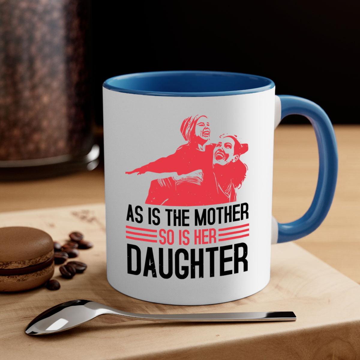 Two-tone ceramic mug with colored handle and interior, featuring the phrase 'As is the mother so is her daughter' for Mother's Day.