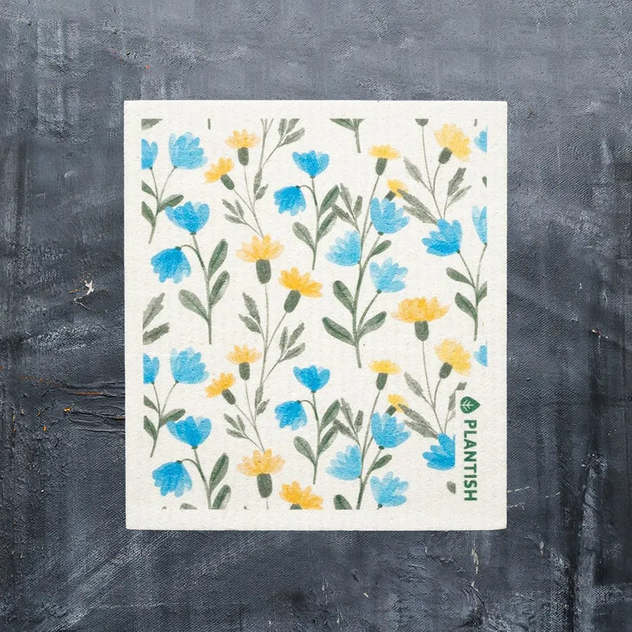 Aster Swedish Sponge Cloth in blue and yellow floral design, showcasing its absorbent and eco-friendly features.