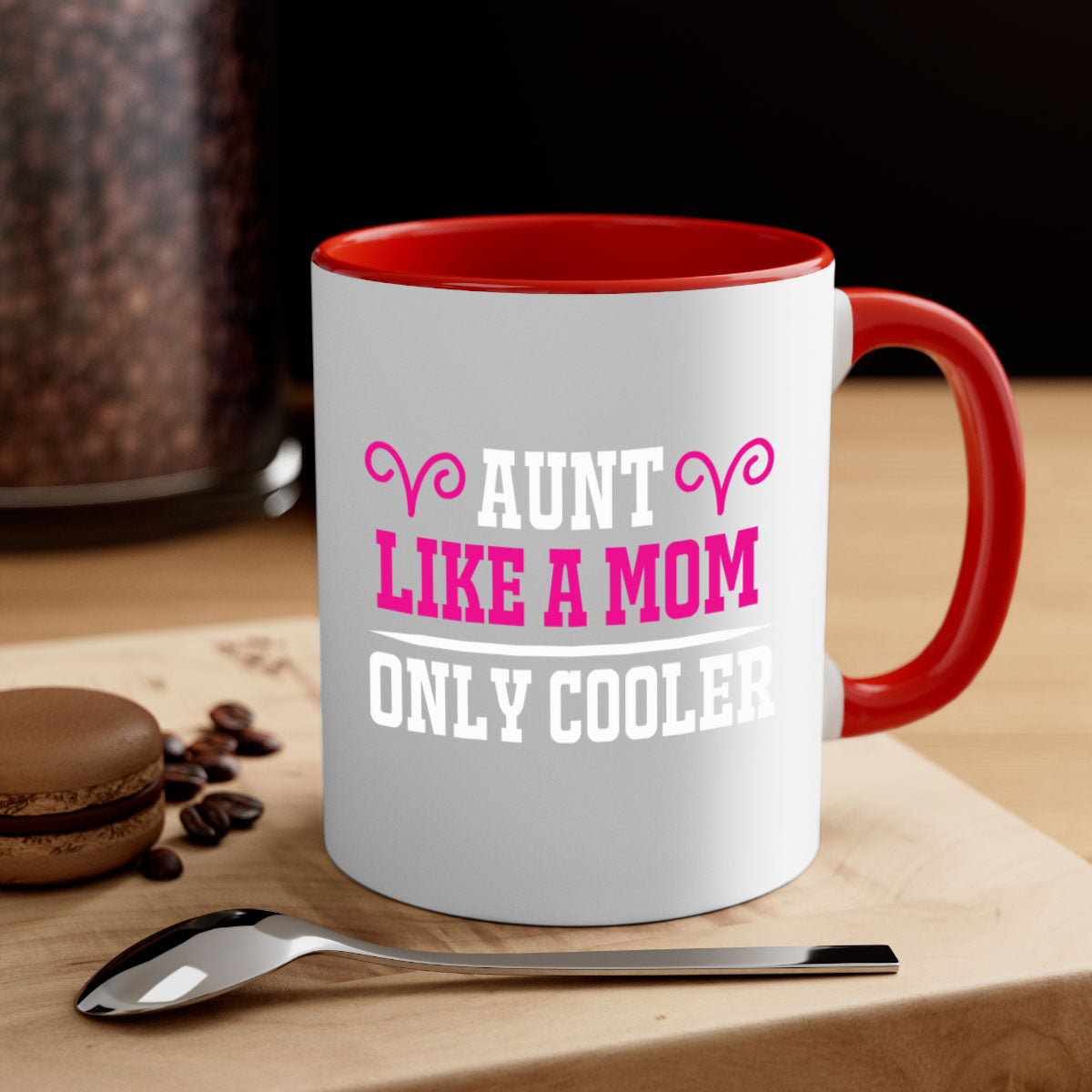 A stylish two-tone coffee mug with a colored handle and glossy finish, featuring the text 'Aunt Like a Mom Only Cooler'.